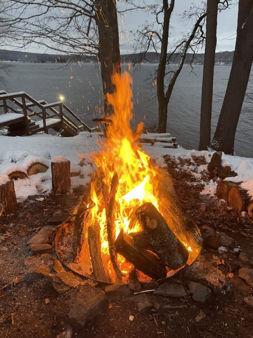 Closeup shot of camp fire across the river