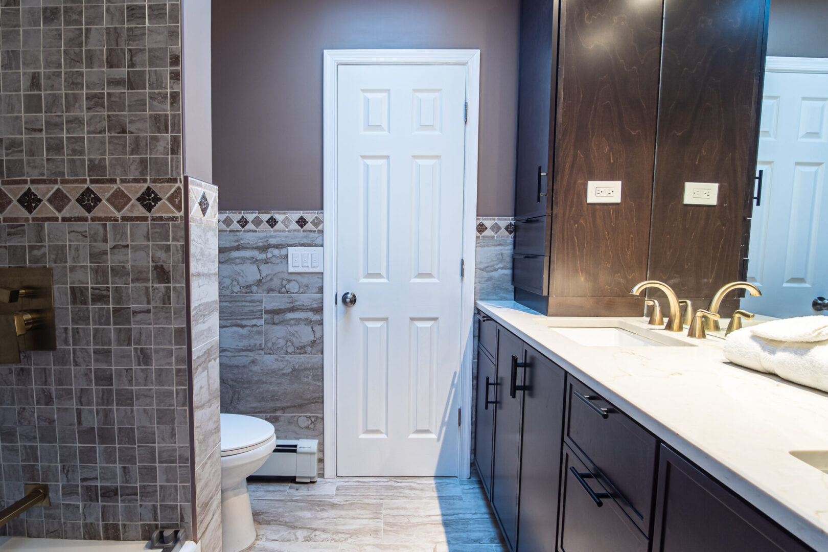 View of the white door inside the washroom