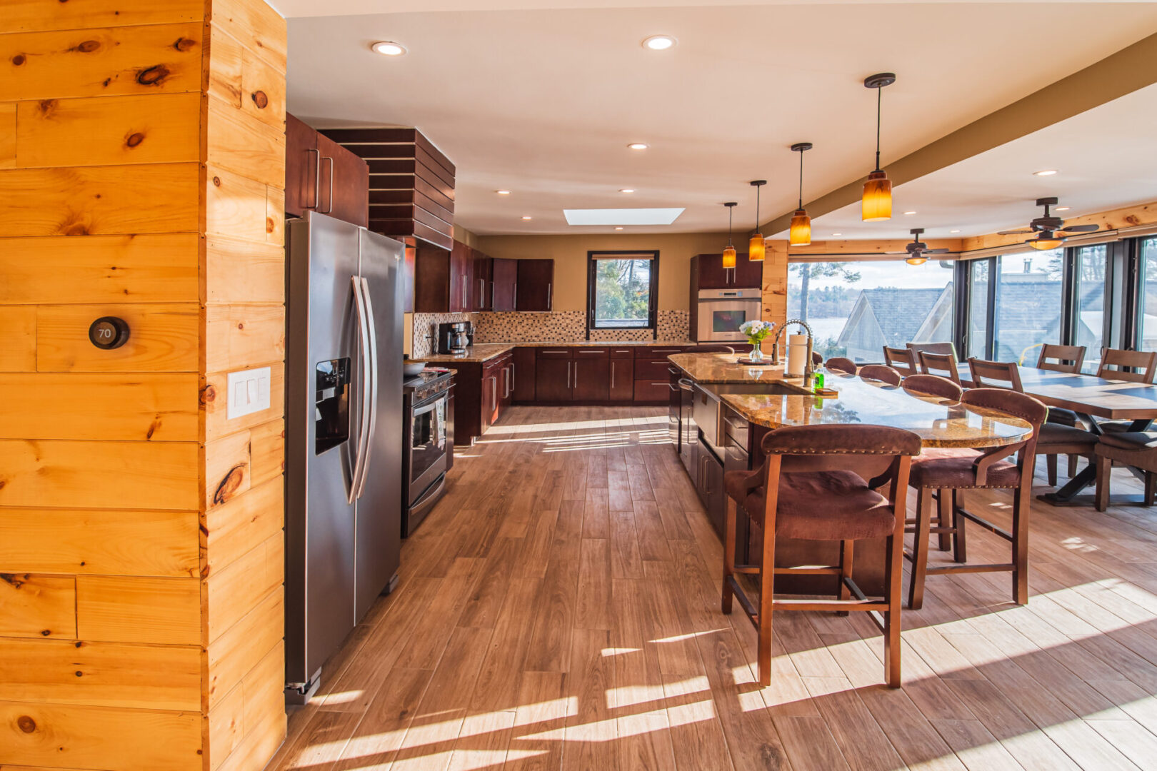 View of the modern kitchen with brown cabinet