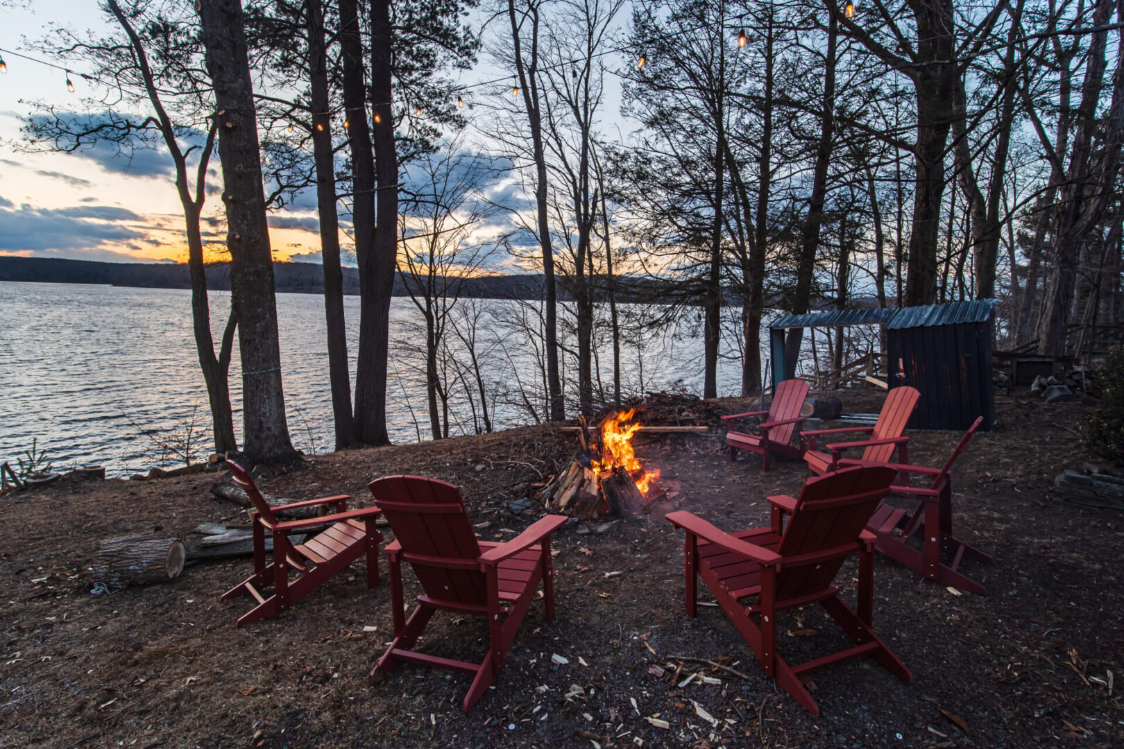 Camp fire surrounded with chairs on the display