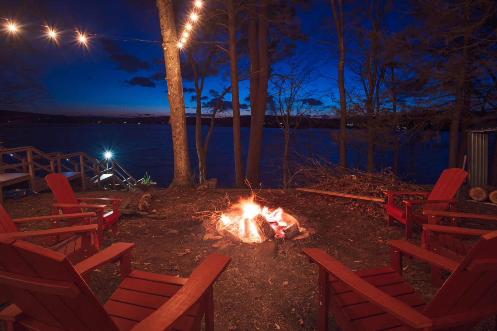 Camp fire surrounded with chairs