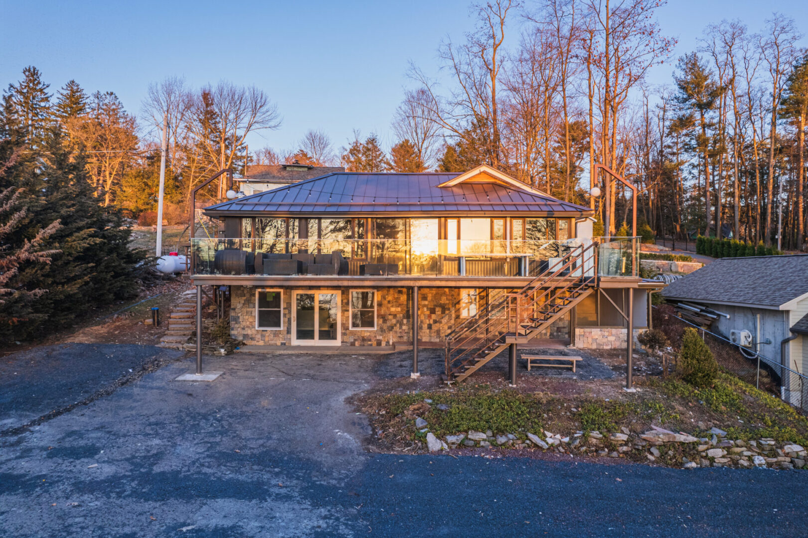 Long view of the house surrounded with trees